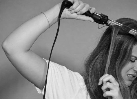 Styling hair with a conventional curling iron