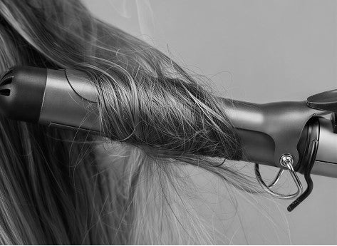 Hair tangled around a conventional curling iron