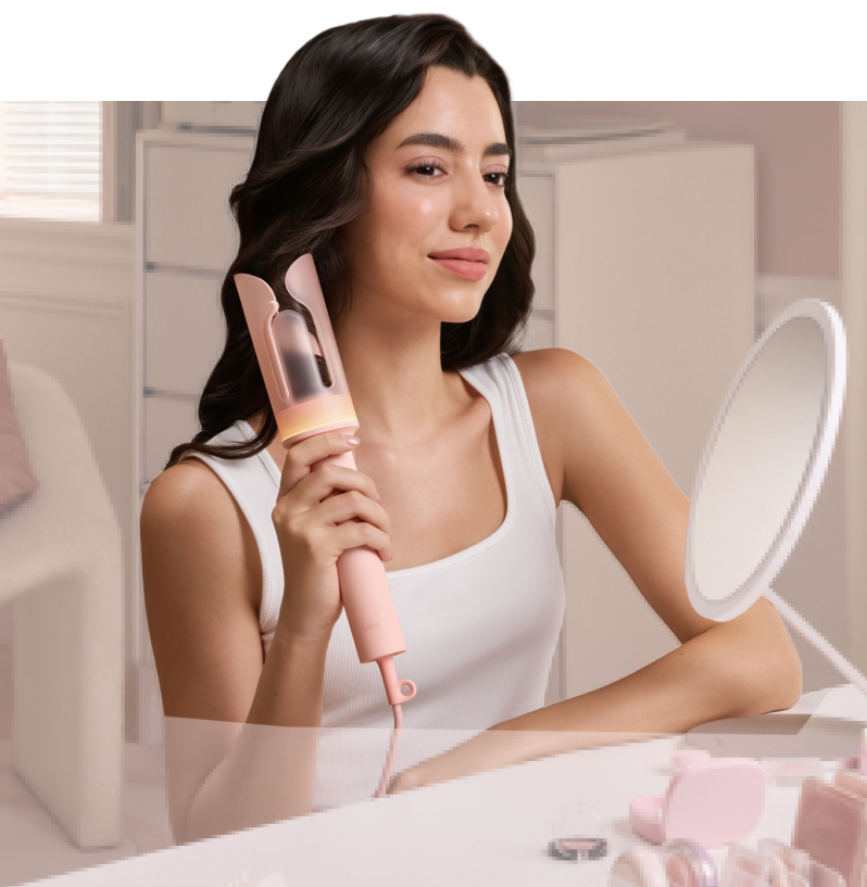 Woman holding a Laifen AutoCurl after styling her hair